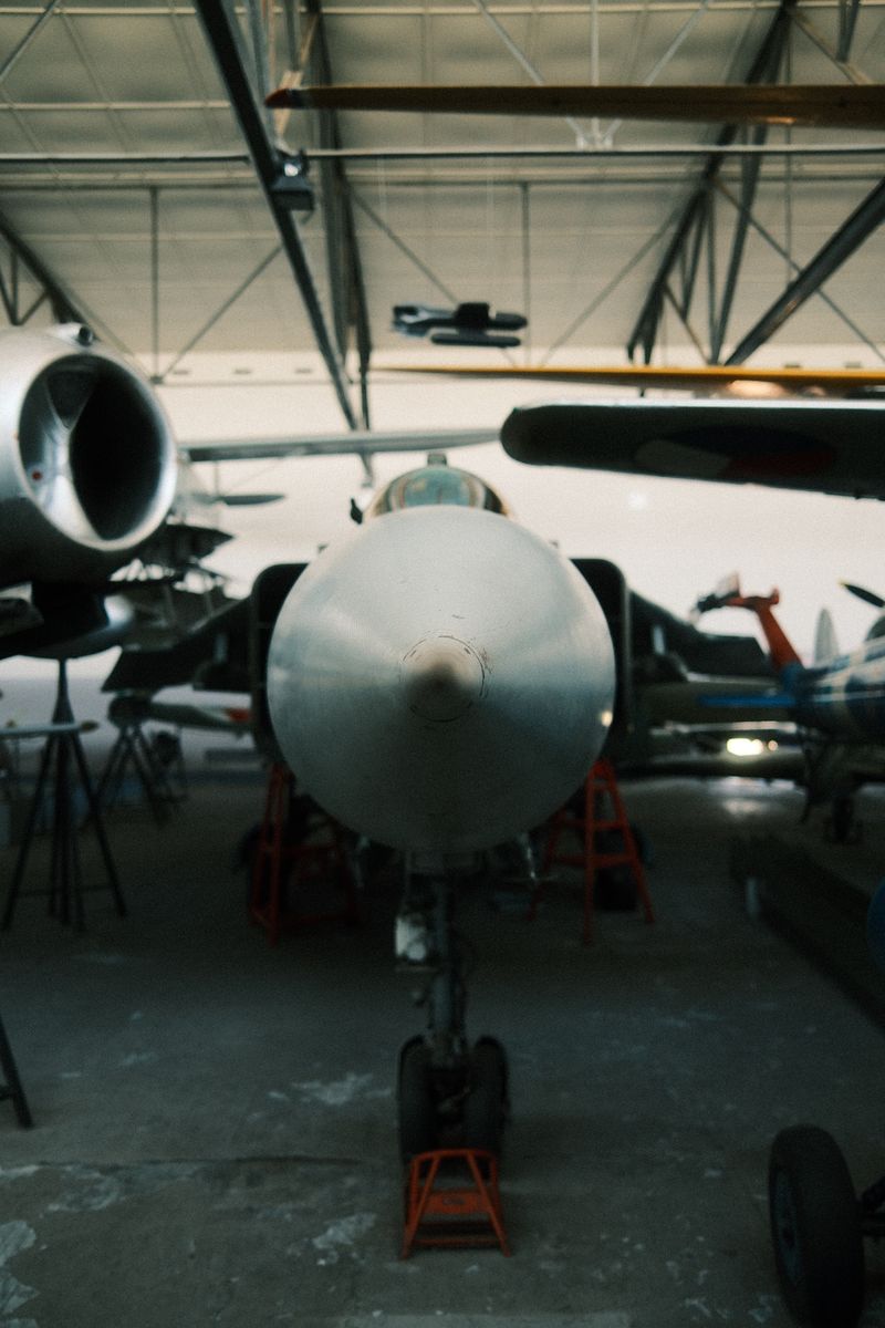 Jet aircraft in a hangar, nose-on