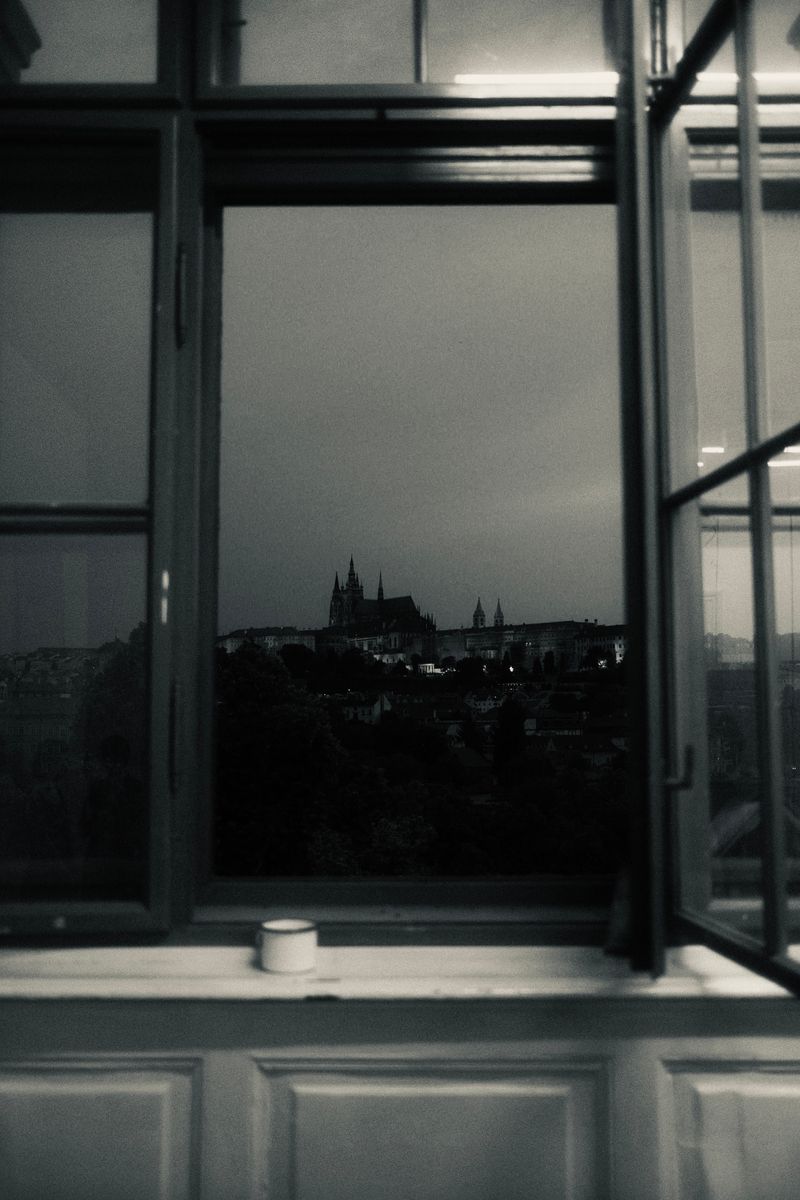 Window view of the castle at dusk