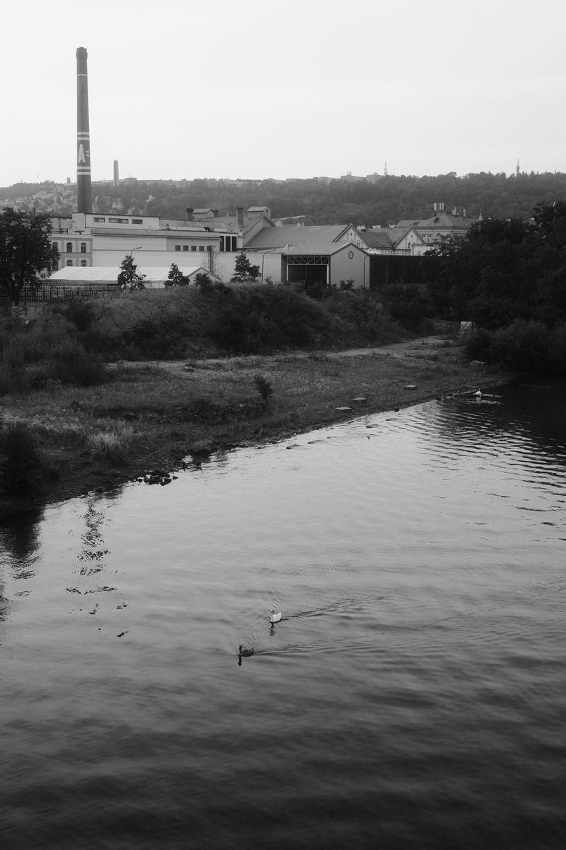River and factory chimney, black and white